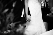 groom and bride holding hands